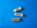 Our contact information symbol. Concept word Our contact information on wooden blocks. Beautiful blue background. Business and Our Royalty Free Stock Photo