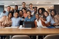 Our deadlines may be tight but our team is tighter. a group of young businesspeople using a laptop at a conference in a Royalty Free Stock Photo