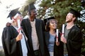 Our future just got a whole lot brighter. a group of students standing together on graduation day. Royalty Free Stock Photo