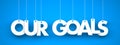 Our Goals - word hanging on blue background