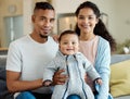 Our heartbeat you can see. Portrait of a young family bonding with their baby boy at home. Royalty Free Stock Photo