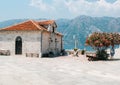 Our Lady of the Rock island and Church in Perast on shore