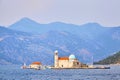 Our Lady of the Rocks church on artificial island in Boka Kotor bay and mountains, Adriatic Sea, Montenegro Royalty Free Stock Photo