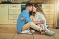 Our love only gets better. loving couple sitting on the living room floor. Royalty Free Stock Photo