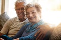 Our marriage has changed over the years. For the better. Portrait of a senior couple relaxing together on the sofa at