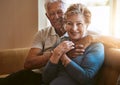 Our marriage just gets better with every passing year. Portrait of a senior couple relaxing together on the sofa at home