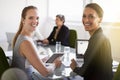 Our meetings are always productive. Cropped portrait of two businesswoman looking back while in a meeting. Royalty Free Stock Photo