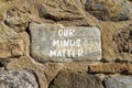 Our minds matter ourmindsmatter symbol. Concept words Our minds matter on beautiful big stone on stone wall. Beautiful stone wall Royalty Free Stock Photo