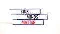 Our minds matter ourmindsmatter symbol. Concept words Our minds matter on beautiful book. Beautiful white table white background. Royalty Free Stock Photo