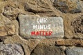 Our minds matter ourmindsmatter symbol. Concept words Our minds matter on beautiful big stone on stone wall. Beautiful stone wall Royalty Free Stock Photo