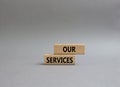 Our services symbol. Concept words Our services on wooden blocks. Beautiful grey background. Business and Our services concept.