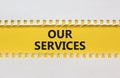 Our services symbol. White and yellow paper with words `Our services`. Beautiful yellow background. Business and our services