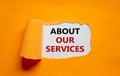 About our services symbol. The words `about our services` appearing behind torn orange paper. Beautiful background. Business and