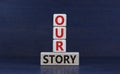 Our story, storytelling symbol. Wooden blocks with words `Our story`. Beautiful grey background. Business and our story,