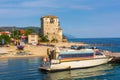 Ouranoupolis town view, harbor, ferry boat and Tower, Athos, Greece