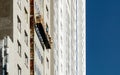 Ourdoor facade lift for facade repair work on a facade under construction without workers Royalty Free Stock Photo