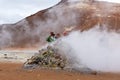 Ourist taking photo at Namafjall geyser