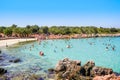 Ourists on the beach with unique sand in Cleopatra island