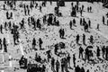 Tourists on San Marco square feed large flock of pigeons Royalty Free Stock Photo