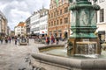 Ourists wander the Stroget shopping district near the Stork Fountain in Copenhagen Denmark