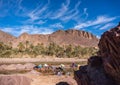OURZAZATE, MOROCCO - JAN 2019: Berber women wash clothes in the river in beautiful picturesque place Oasis de Fint