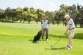 Out for a day of golf. Golfing companions out on the course playing a round of golf. Royalty Free Stock Photo