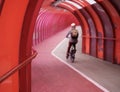Commuting Cyclist In Urban Walkway