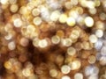 Out of Focus, Defocused, Blurred, Abstract and Bokeh of Sparkling Gold Lights, Suitable for Background Use