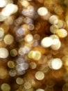 Out of Focus, Defocused, Blurred, Abstract and Bokeh of Sparkling Gold Lights, Suitable for Background Use