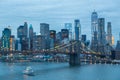 Out of focus image of Brooklyn Bridge and Lower Manhattan skyline at night, New York city, USA. Royalty Free Stock Photo