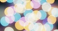 Out-of-focus, multi-colored bokeh lights create a soft, abstract pattern. Circular Royalty Free Stock Photo