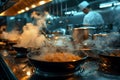 Out of focus professional chef preparing restaurant quality food in a professional kitchen, steaming pan of noodles or spaghetti,