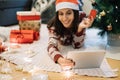 Out of focus smiling woman holding on focus tablet