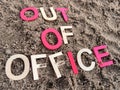 Out of office message on sand at the beach Royalty Free Stock Photo