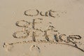 Out of office text written in sand on a beach Royalty Free Stock Photo