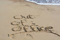 Out of office text written in sand on a beach Royalty Free Stock Photo