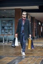 Out and about on a serious shopping spree. a well dressed young man on a shopping spree. Royalty Free Stock Photo