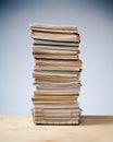 Desk tray with tall stack of files and paper work.