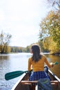 Out into the wild and onto the water. a young woman going for a canoe ride on the lake. Royalty Free Stock Photo