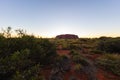 Outback, Australia - November 12, 2022: Sunrise at the Majestic Uluru or Ayers Rock at in the Northern Territory, Australia. The Royalty Free Stock Photo