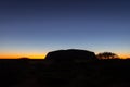 Outback, Australia - November 12, 2022: Sunrise at the Majestic Uluru or Ayers Rock in the Northern Territory, Australia. The red Royalty Free Stock Photo