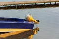 Outboard motor on a blue aluminum fishing boat, outboard motor on a pleasure boat, lake