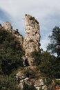 Outcrop with bushes on it surrounded with tree Royalty Free Stock Photo