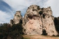 Outcrop with bushes on it surrounded with tree Royalty Free Stock Photo