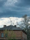 Obsolete rusty television antennas on the roof of an old house. Analog technology