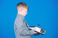 Outdated gadget. Retro and vintage. Yard sale. Retrospective study. Boy hold retro typewriter on blue background. What Royalty Free Stock Photo
