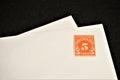 Antique United States Postal Service stamp on blank white envelope