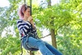 Outdoor teenager girl having fun on bungee jumping Royalty Free Stock Photo