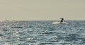 Outdoor activities at sea riding on a Board holding a rope. Wakeboarding on the sea