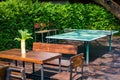 Outdoor adapted Table tennis in the recreation and relax zone on wood stage in garden area Royalty Free Stock Photo